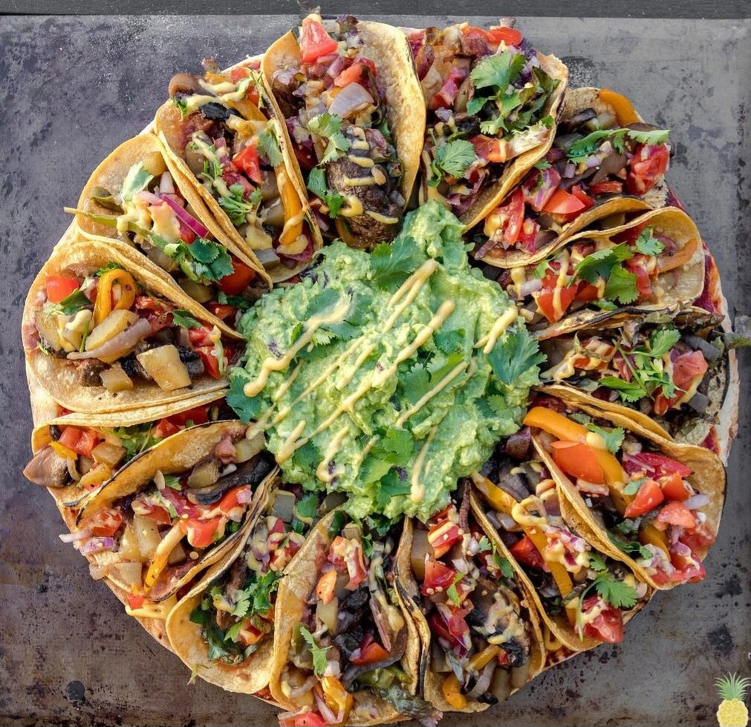 Shrimp, steak and pork tacos with red and green salsa